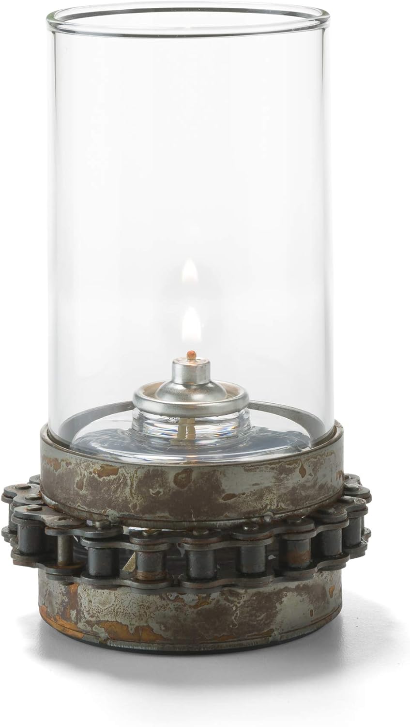 Decorative lamp with glass cylinder and metal base on a white background